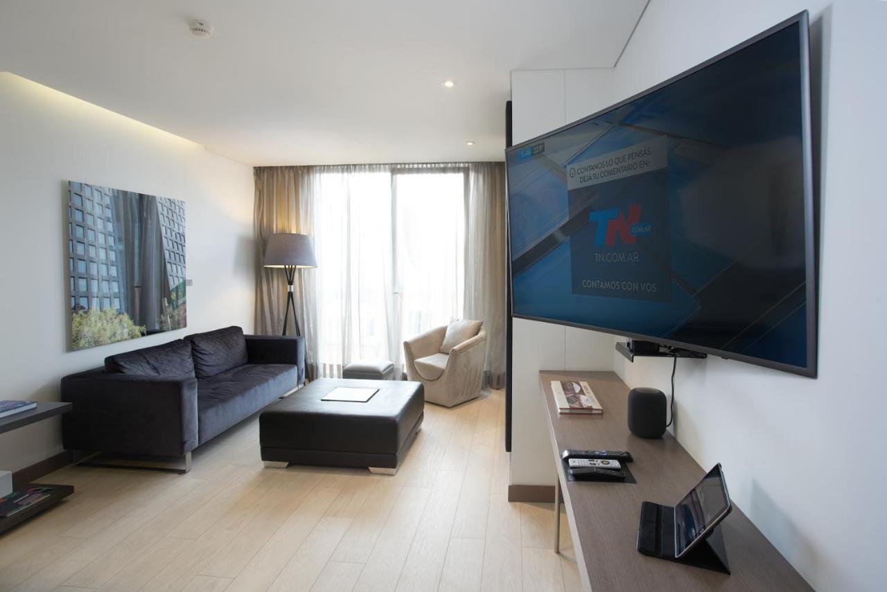 Hotel 100 Luxury Suites By Preferred Bogotá Exterior foto A television set in a hotel room